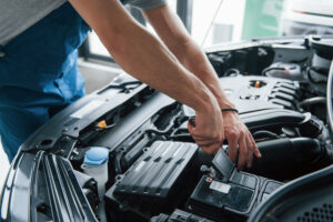 repairing-car-battery-man-working-with-engine-hood